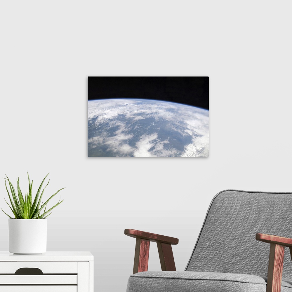 A modern room featuring View of planet Earth from space
