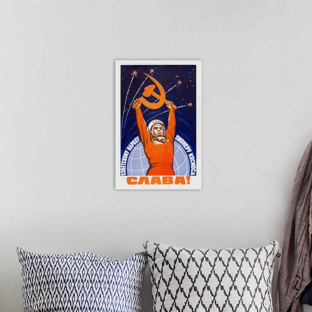 A bohemian room featuring Vintage Soviet space poster of a cosmonaut raising a hammer and sickle.