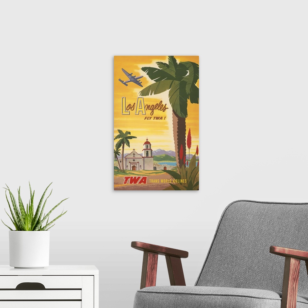 A modern room featuring Vintage travel poster, Fly TWA to Los Angeles, shows airplane flying over a Spanish mission churc...