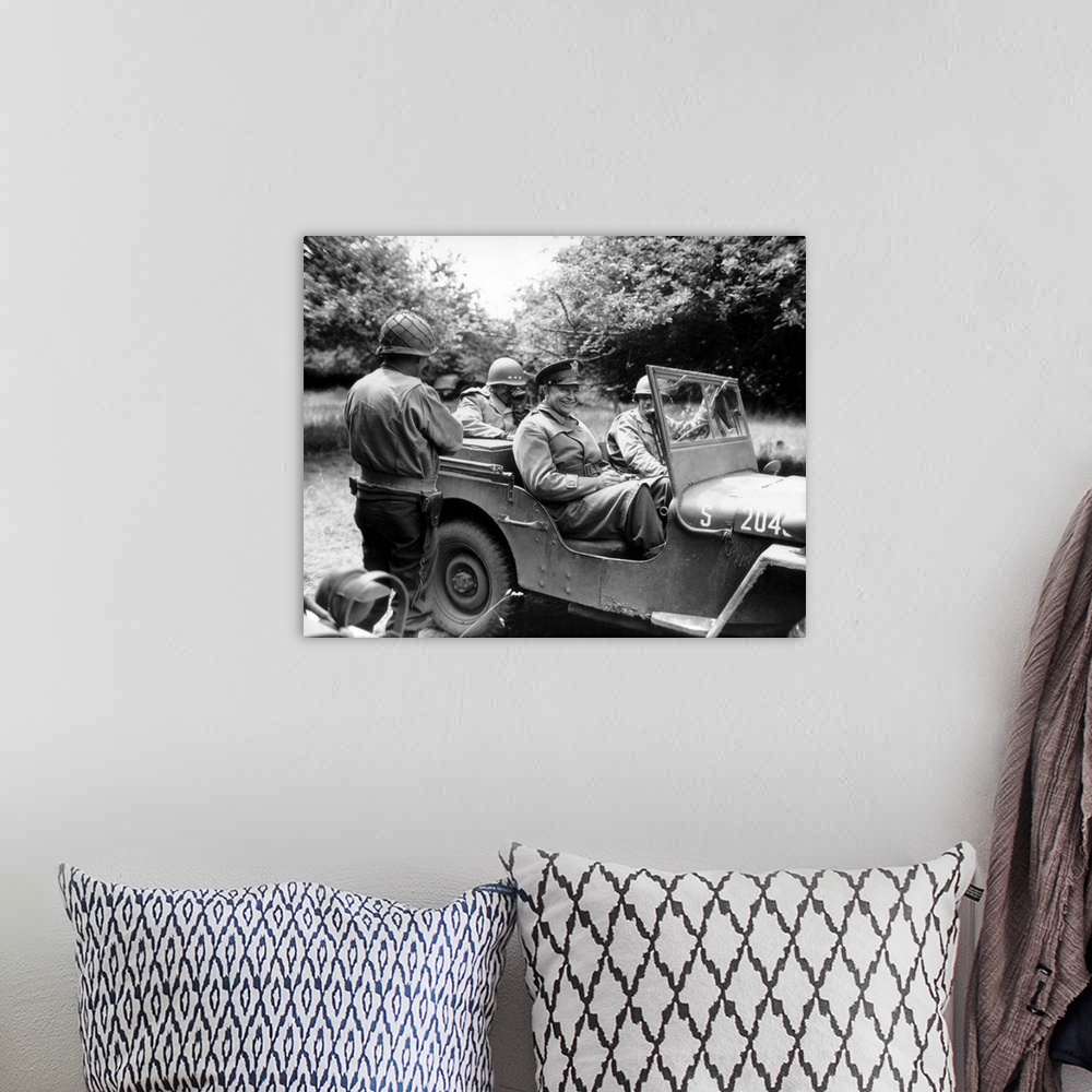 A bohemian room featuring Vintage World War II photo of General Dwight D. Eisenhower sitting in a jeep talking with other o...