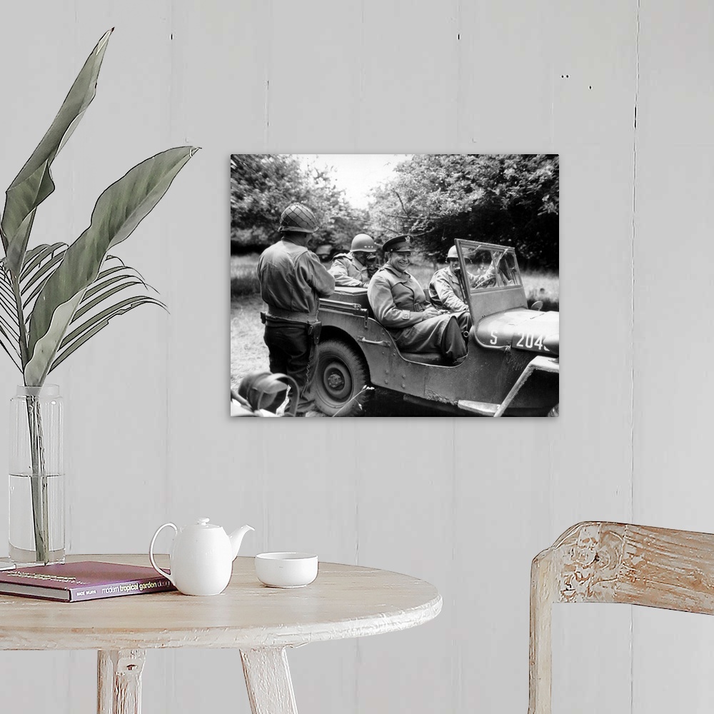A farmhouse room featuring Vintage World War II photo of General Dwight D. Eisenhower sitting in a jeep talking with other o...