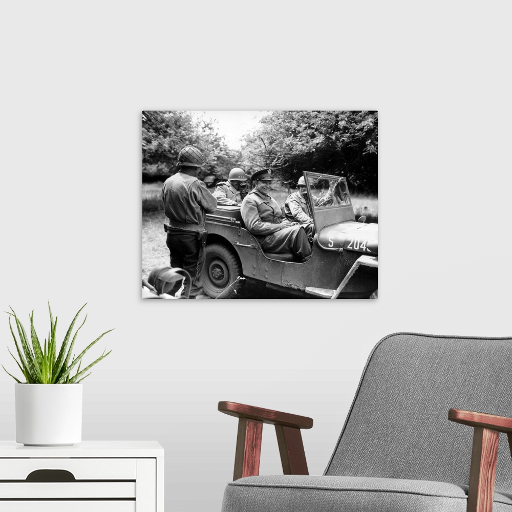 A modern room featuring Vintage World War II photo of General Dwight D. Eisenhower sitting in a jeep talking with other o...