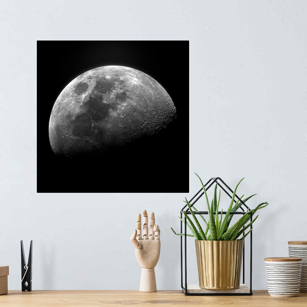 A bohemian room featuring Clear photograph of one of the moon's phases showing well-defined craters, fading to the shadowy ...