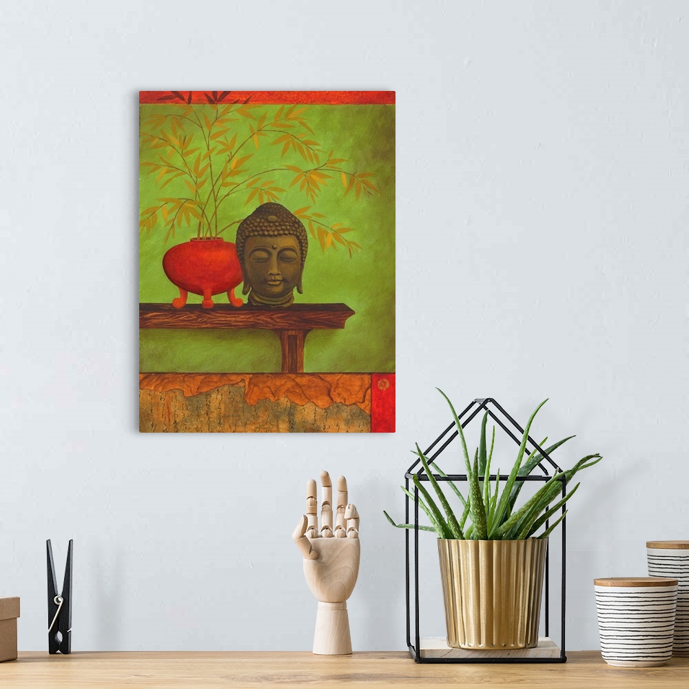 A bohemian room featuring Asian style artwork of a bust of Buddha on a shelf with a red vase full of bamboo.