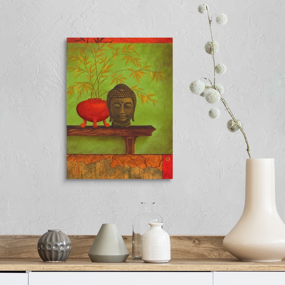A farmhouse room featuring Asian style artwork of a bust of Buddha on a shelf with a red vase full of bamboo.
