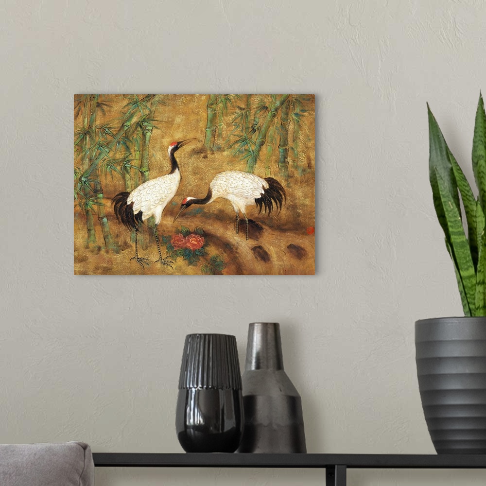A modern room featuring Asian style painting of two cranes foraging in bamboo.