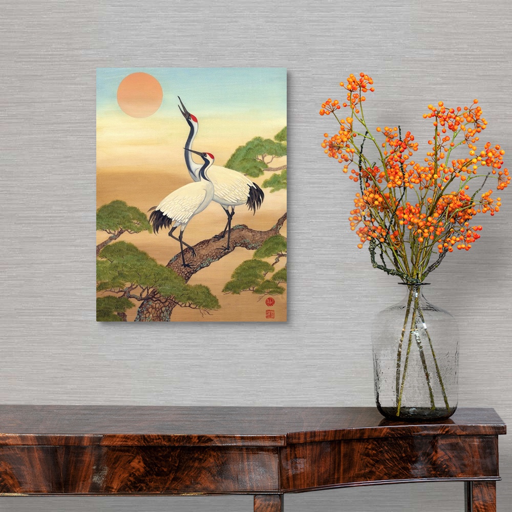 A traditional room featuring Asian style painting of two cranes perched in a tree, looking at the sun.