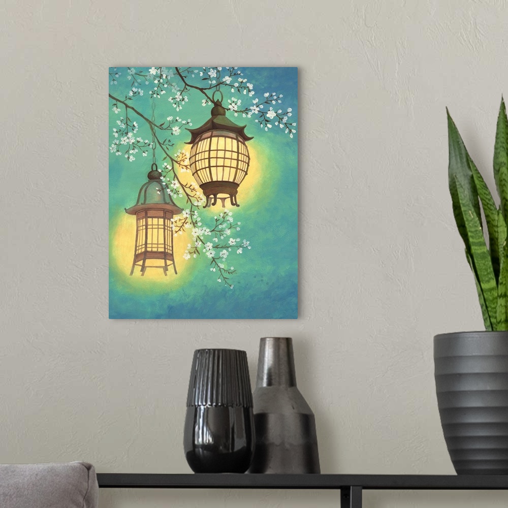 A modern room featuring Asian style painting of two lit lanterns hanging in a cherry tree.