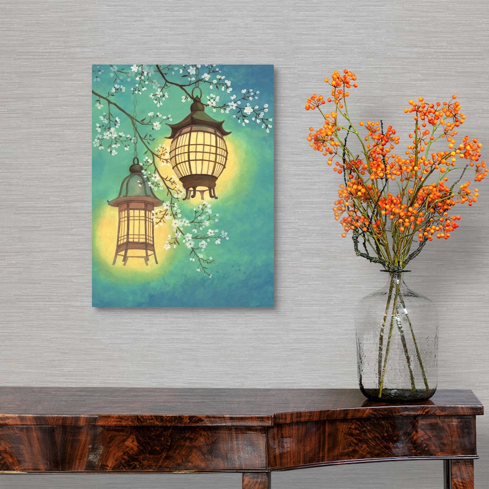 A traditional room featuring Asian style painting of two lit lanterns hanging in a cherry tree.