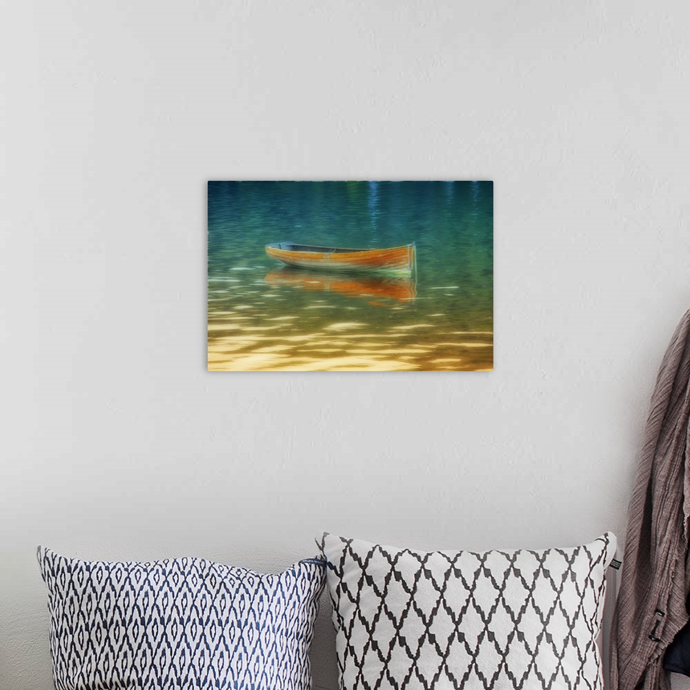 A bohemian room featuring A bright orange boat floating on golden water.