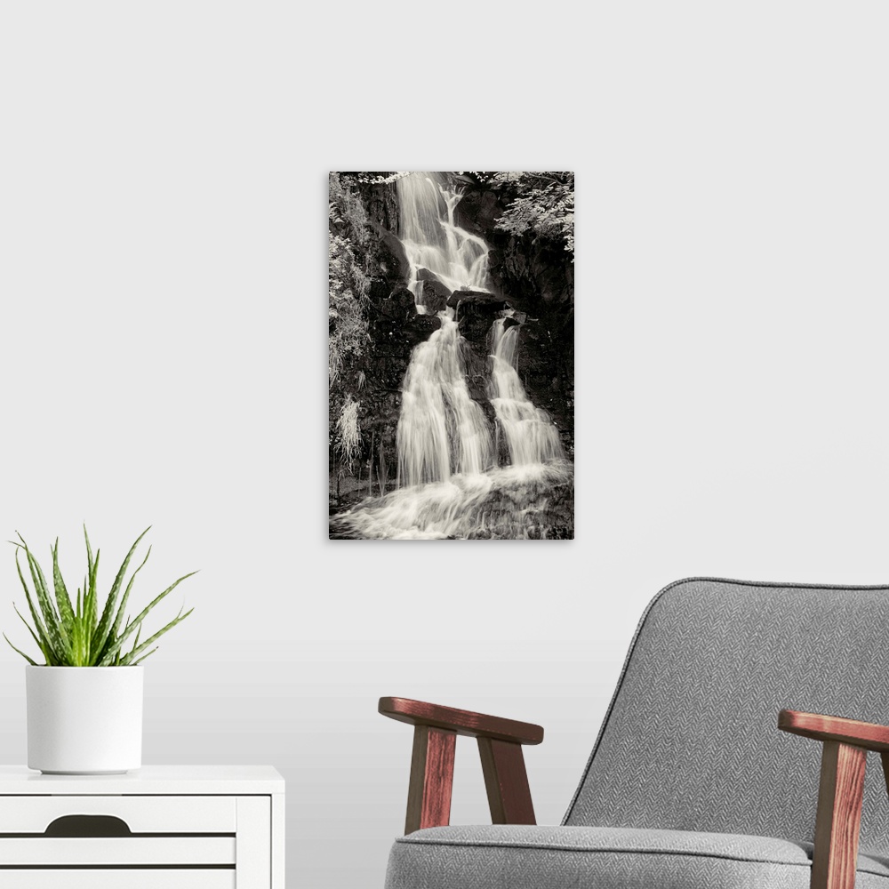 A modern room featuring Black and white photograph of a waterfall in Scotland.