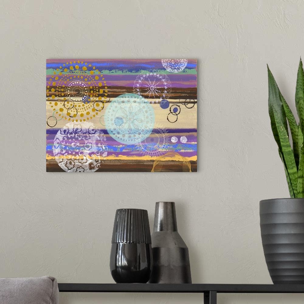 A modern room featuring Abstract artwork of horizontal layers of yellow and purple, embellished with circular prints.