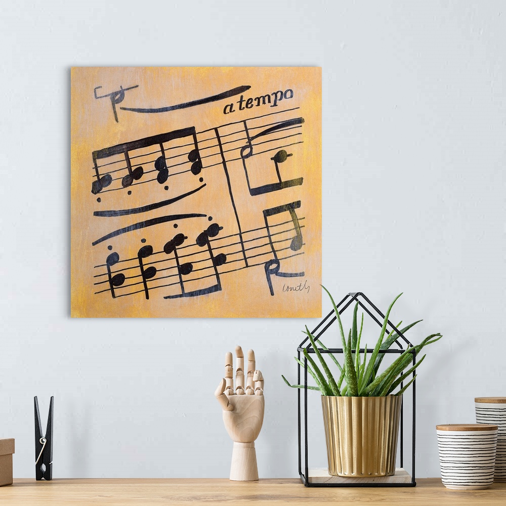 A bohemian room featuring Square painting of black sheet music on a metallic gold background.