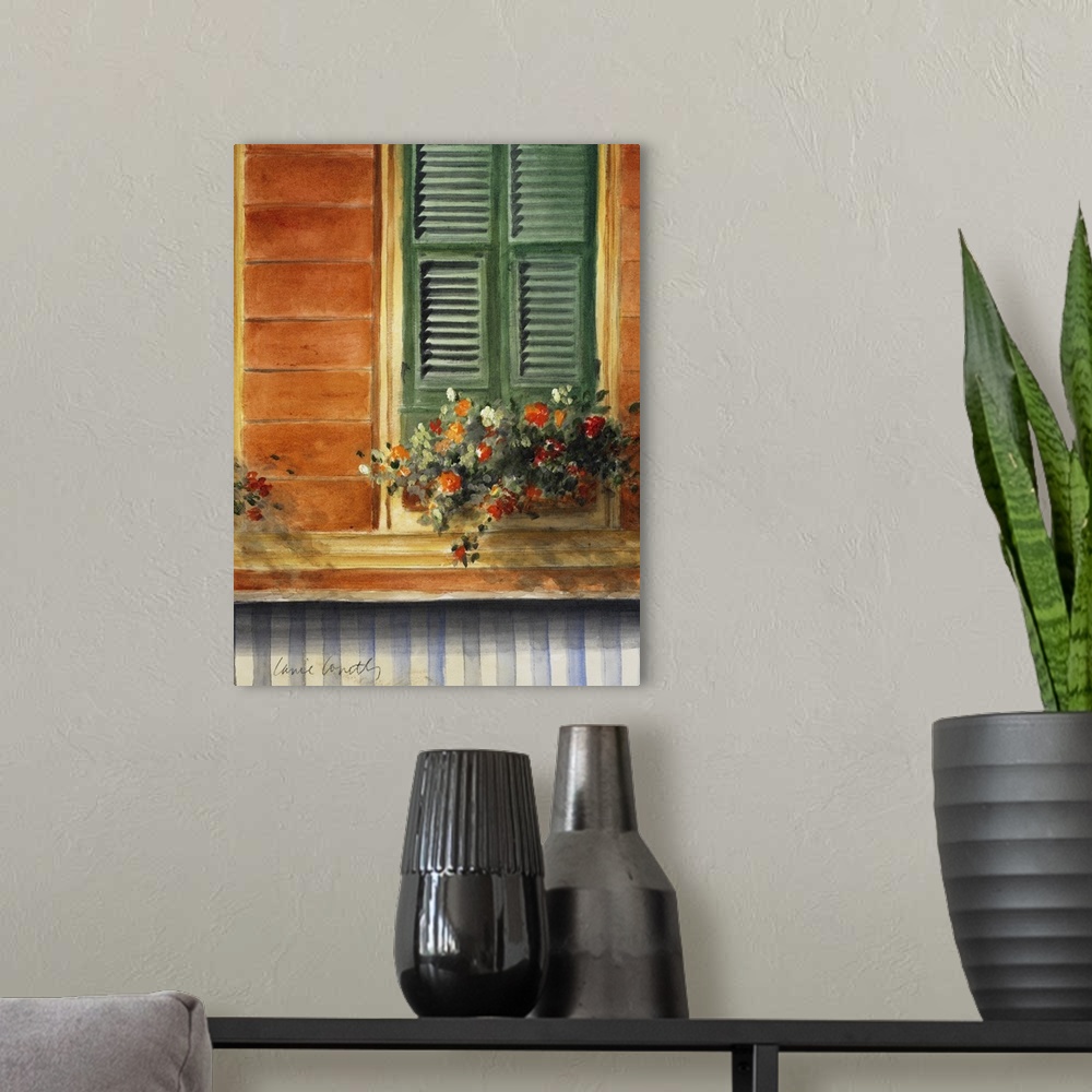 A modern room featuring A painting of flowers that sit in a pot just below a window with green shutters that are closed.