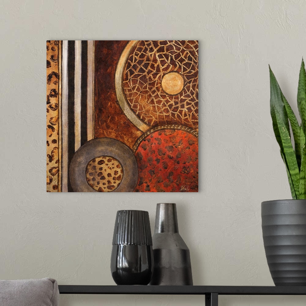 A modern room featuring Abstract artwork that consists of three circles each filled with a different animal pattern. Stri...