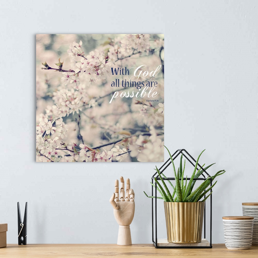 A bohemian room featuring Square photograph of floral tree branches with white and pink flowers and the Bible verse "With G...