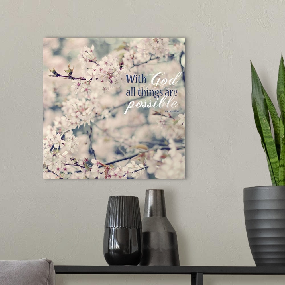 A modern room featuring Square photograph of floral tree branches with white and pink flowers and the Bible verse "With G...