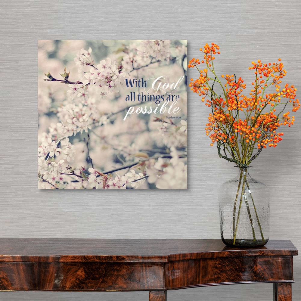 A traditional room featuring Square photograph of floral tree branches with white and pink flowers and the Bible verse "With G...
