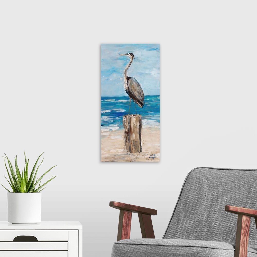A modern room featuring Contemporary painting of a heron standing on wooden post on a beach.