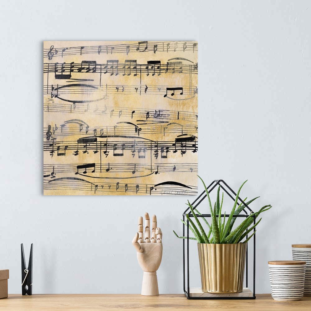 A bohemian room featuring Square painting of black sheet music on a metallic gold background with a silver overlay giving i...