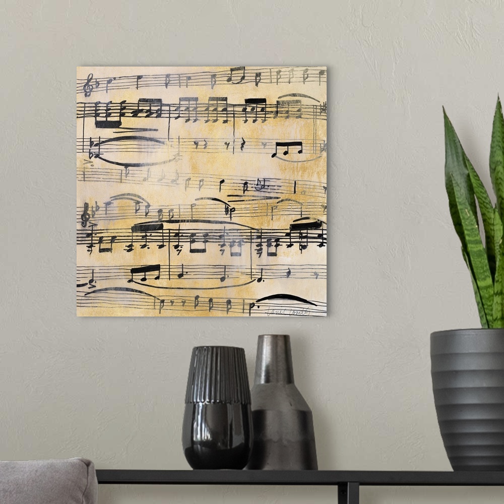 A modern room featuring Square painting of black sheet music on a metallic gold background with a silver overlay giving i...