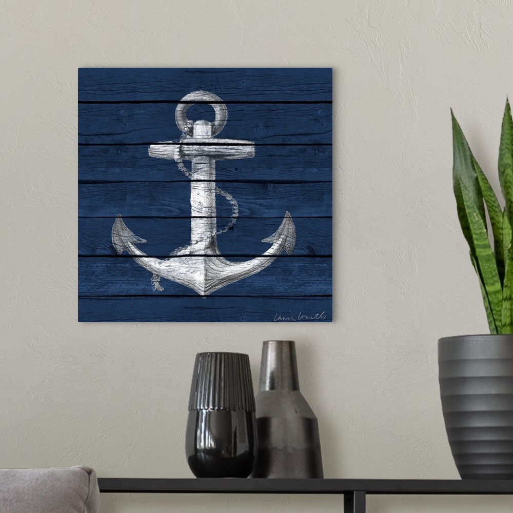 A modern room featuring A painting of an anchor on a blue wood paneled background.