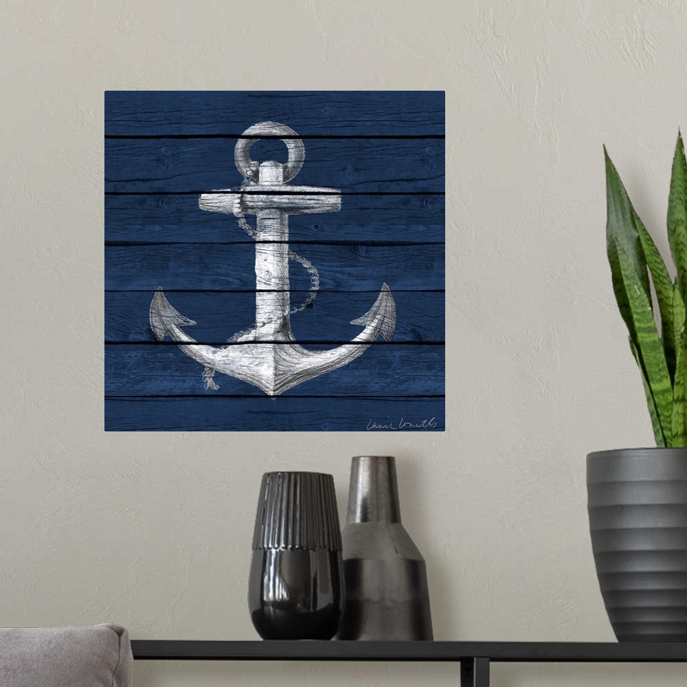 A modern room featuring A painting of an anchor on a blue wood paneled background.