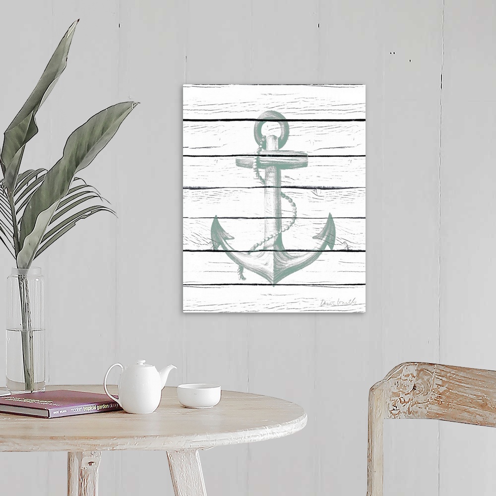 A farmhouse room featuring A painting of an anchor with sea-foam green hues on a white wood paneled background.