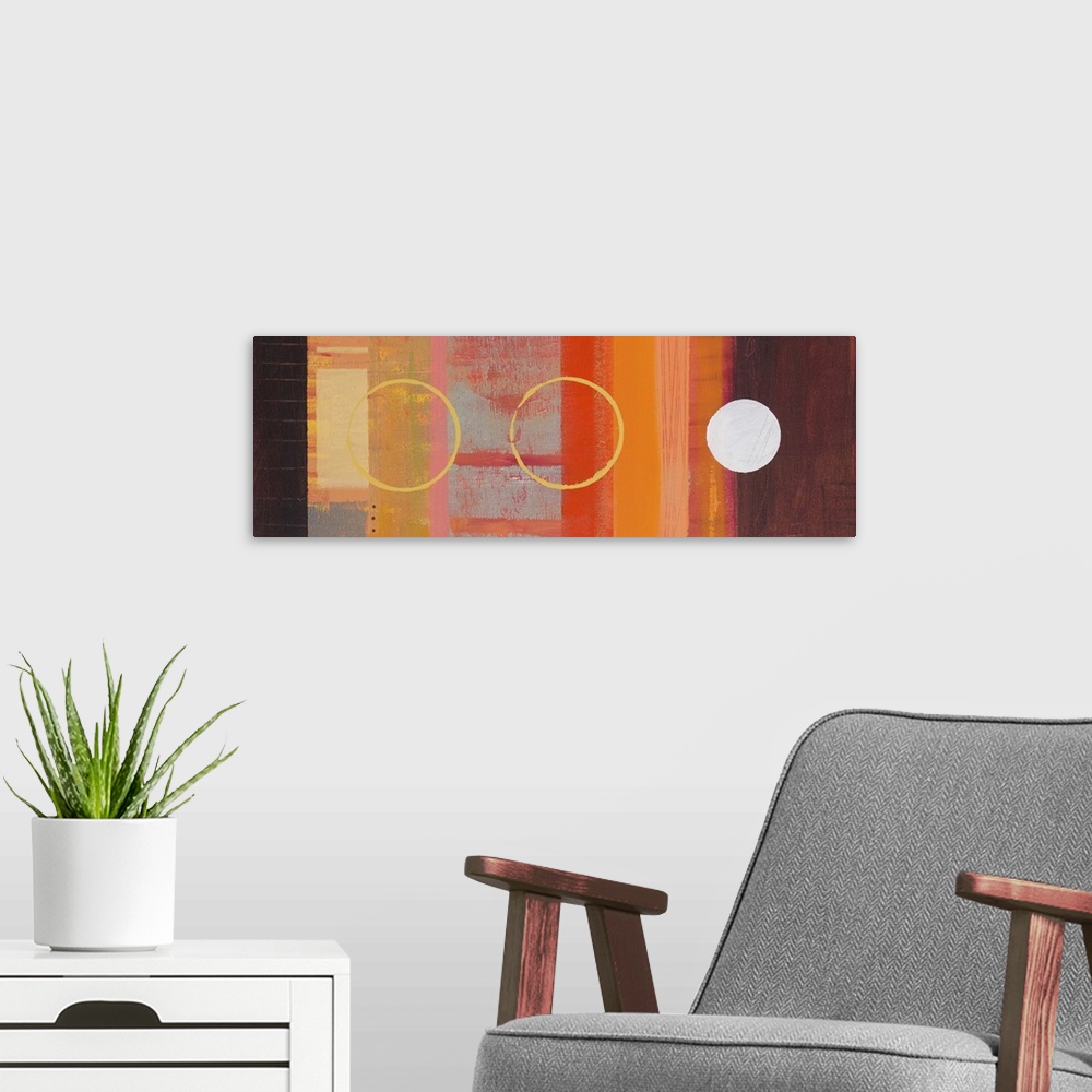 A modern room featuring Abstract painting in warm orange and brown shades, with circular shapes and blocks of color.