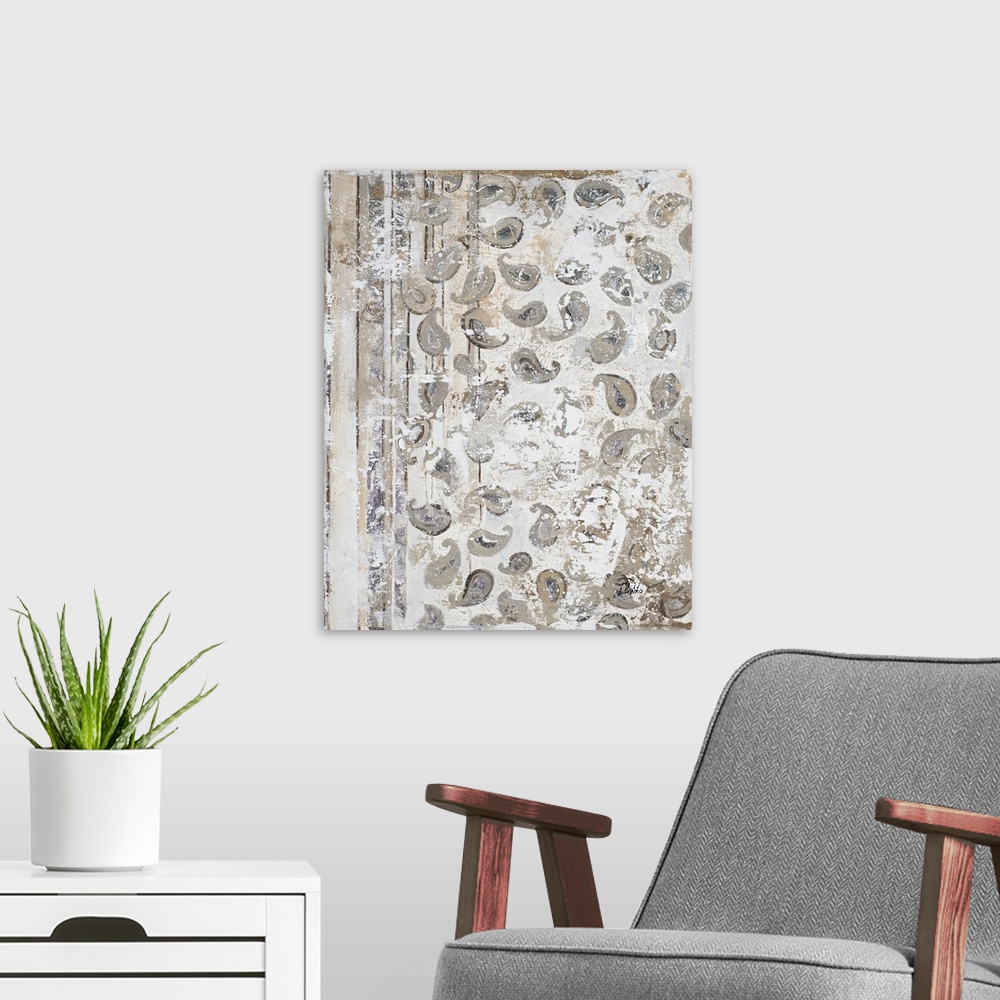 A modern room featuring A vertical abstract painting with an antique paisley pattern in gray, tan, and white hues.