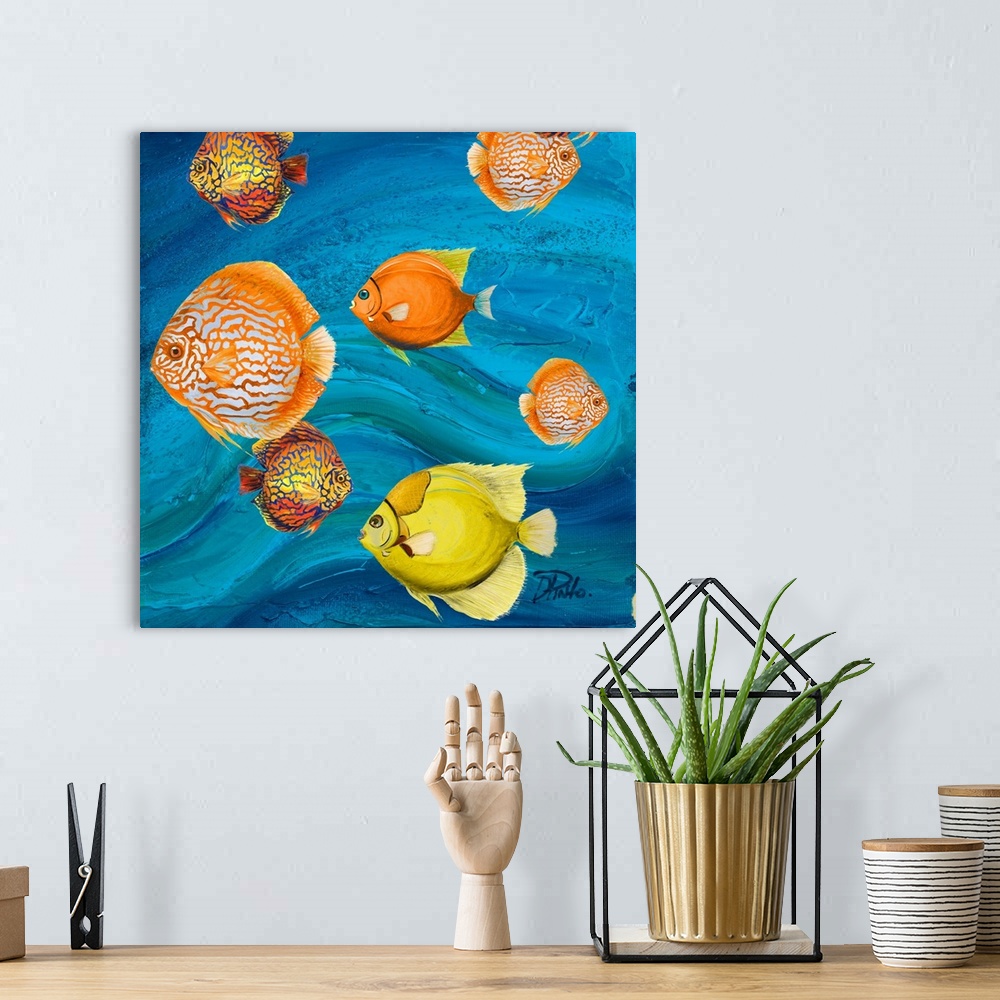 A bohemian room featuring Decorative artwork of a group of tropical fish in yellow and orange.