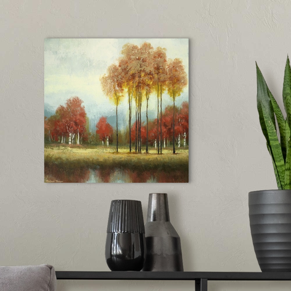A modern room featuring Painting of a countryside clearing with tall and short trees in autumn foliage in front a river.