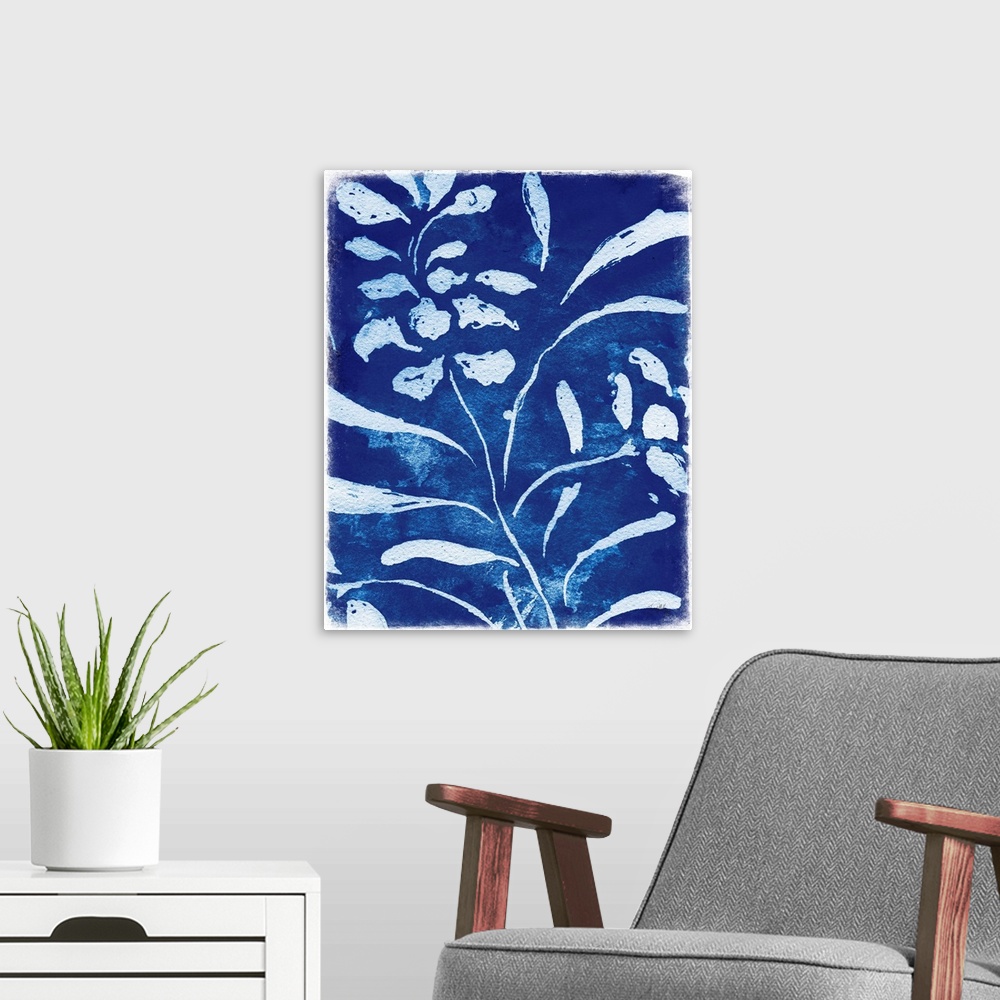 A modern room featuring White silhouette painting of flowers and leaves on an indigo background.