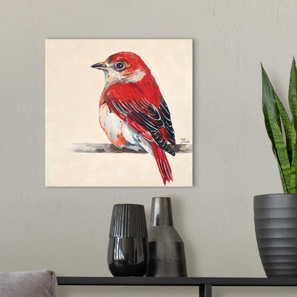A modern room featuring Painting of a bright red little bird perched on a twig.