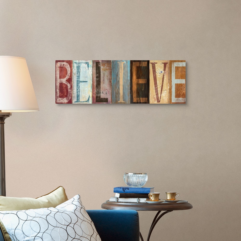 A traditional room featuring The word "Believe" with each letter painted in a different style in muted colors, with a worn, we...
