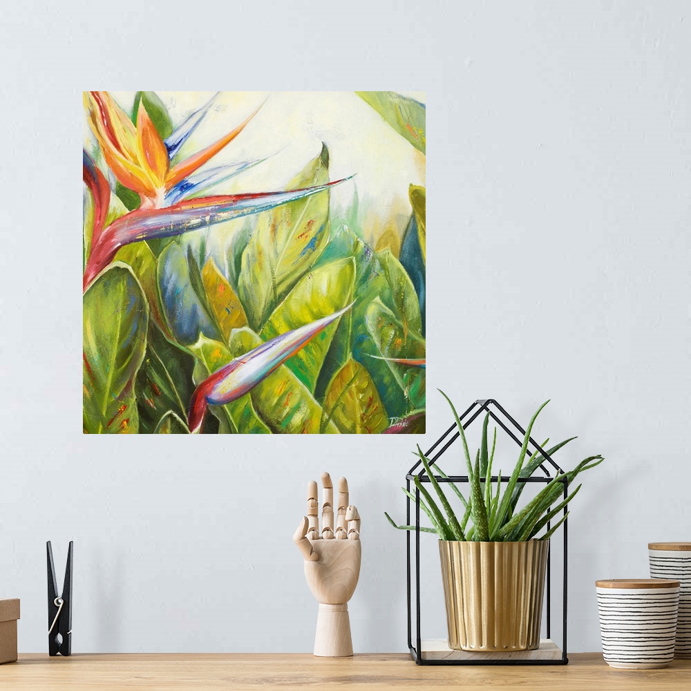 A bohemian room featuring Square, giant floral painting of two bird of paradise flowers, one bloomed, amongst a large bunch...