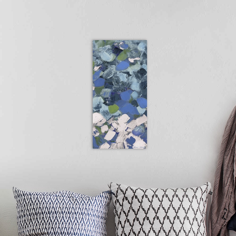 A bohemian room featuring Abstract art with blue and white spots.