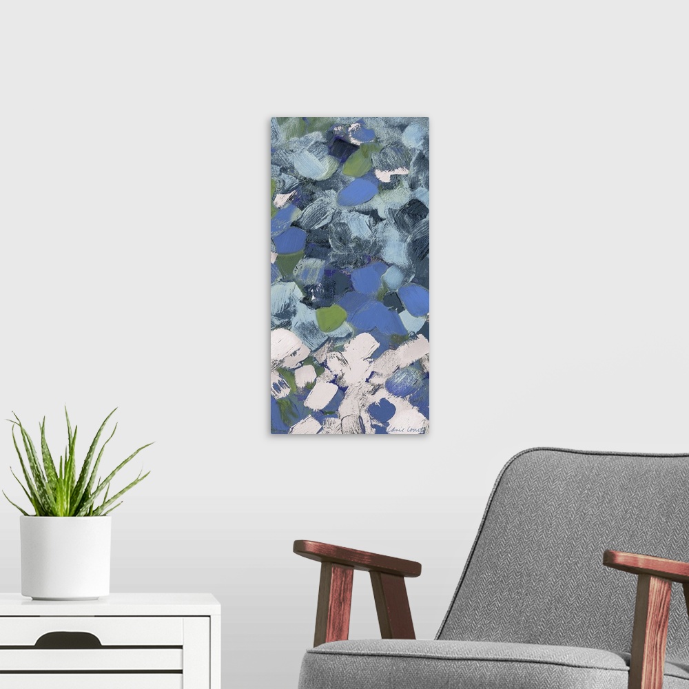 A modern room featuring Abstract art with blue and white spots.