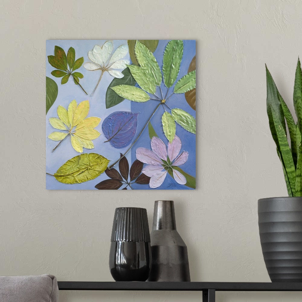 A modern room featuring A contemporary cool toned painting of a variety of different leaves.