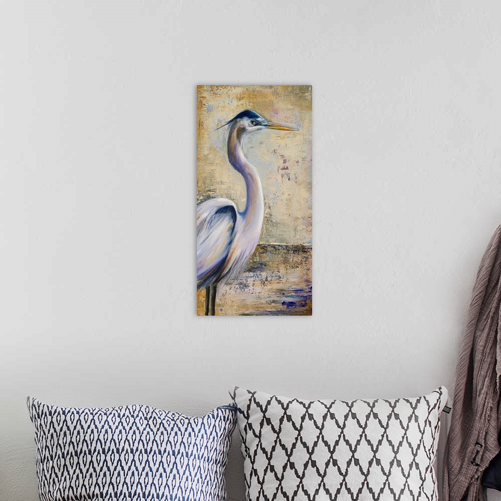 A bohemian room featuring A large vertical piece of a painting of a heron with an antiqued background.