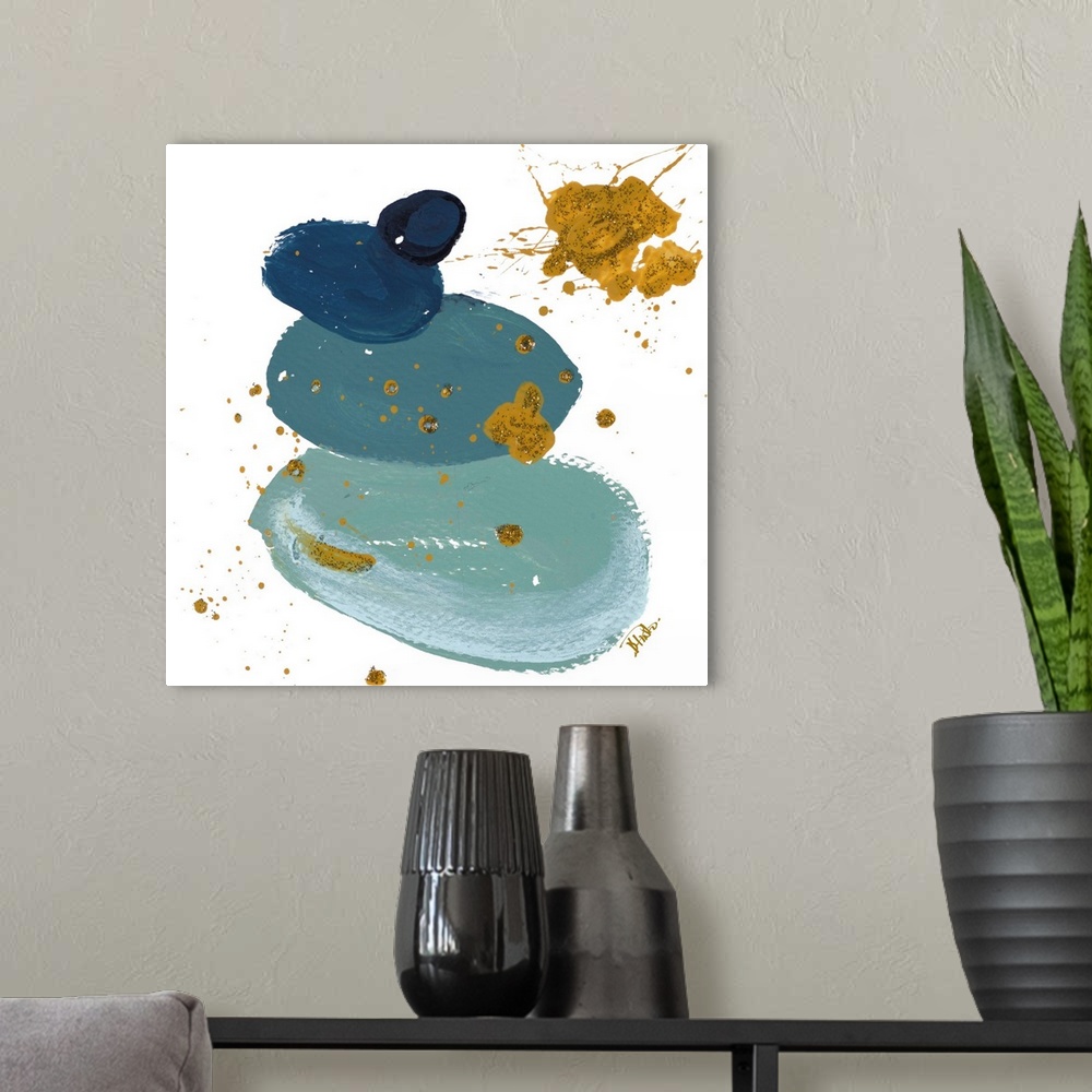 A modern room featuring Abstract artwork featuring thick brush strokes in shades of blue with gold color splatters and sp...