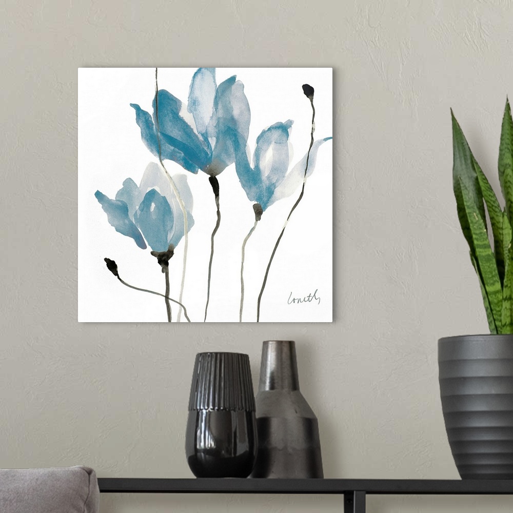 A modern room featuring A square watercolor painting of three blue flowers with thin, black stems.