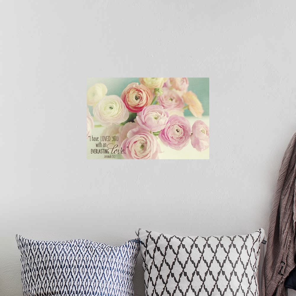 A bohemian room featuring Pastel-toned image of pink flowers with a Bible verse.