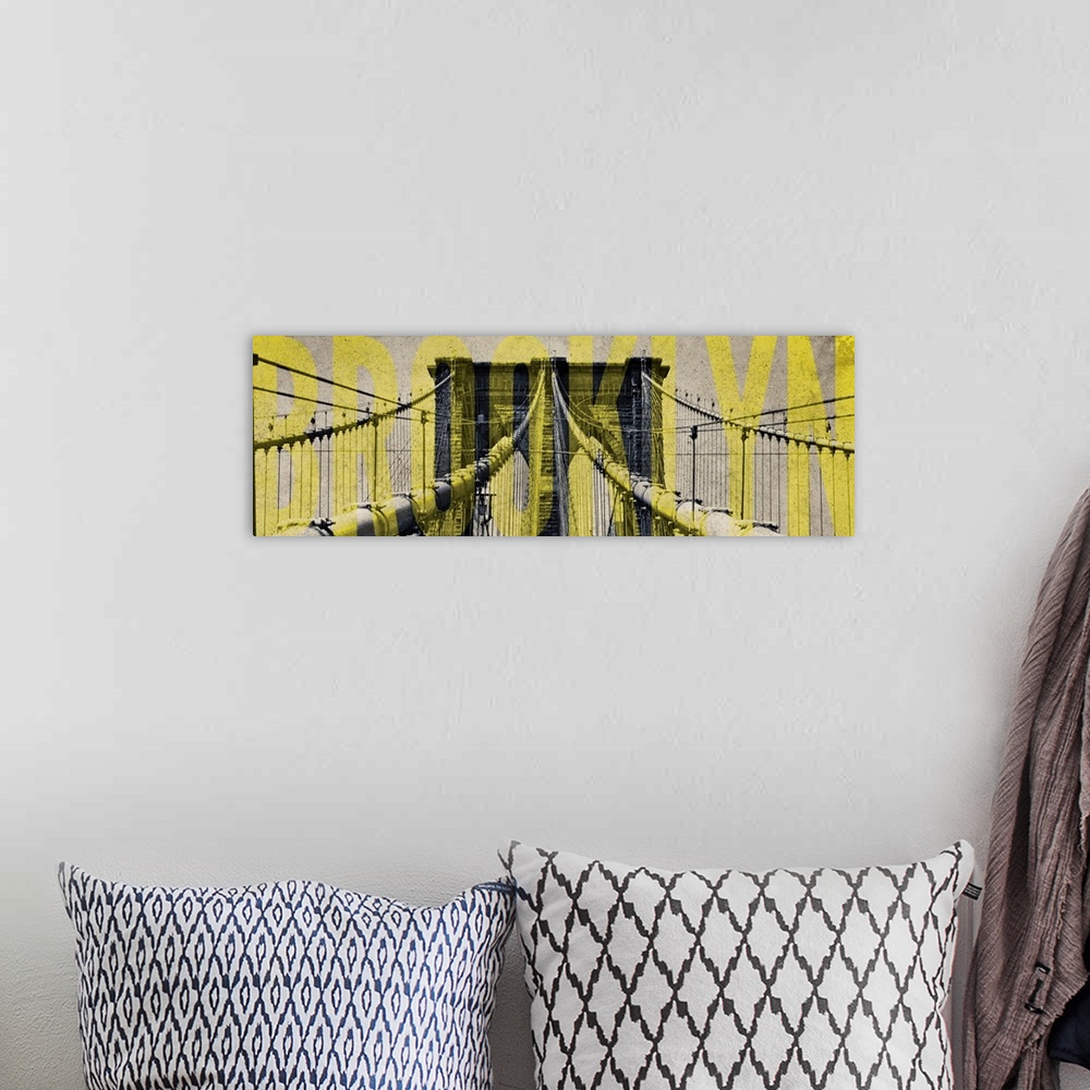 A bohemian room featuring One of the towers of the Brooklyn Bridge with "Brooklyn" in yellow lettering.