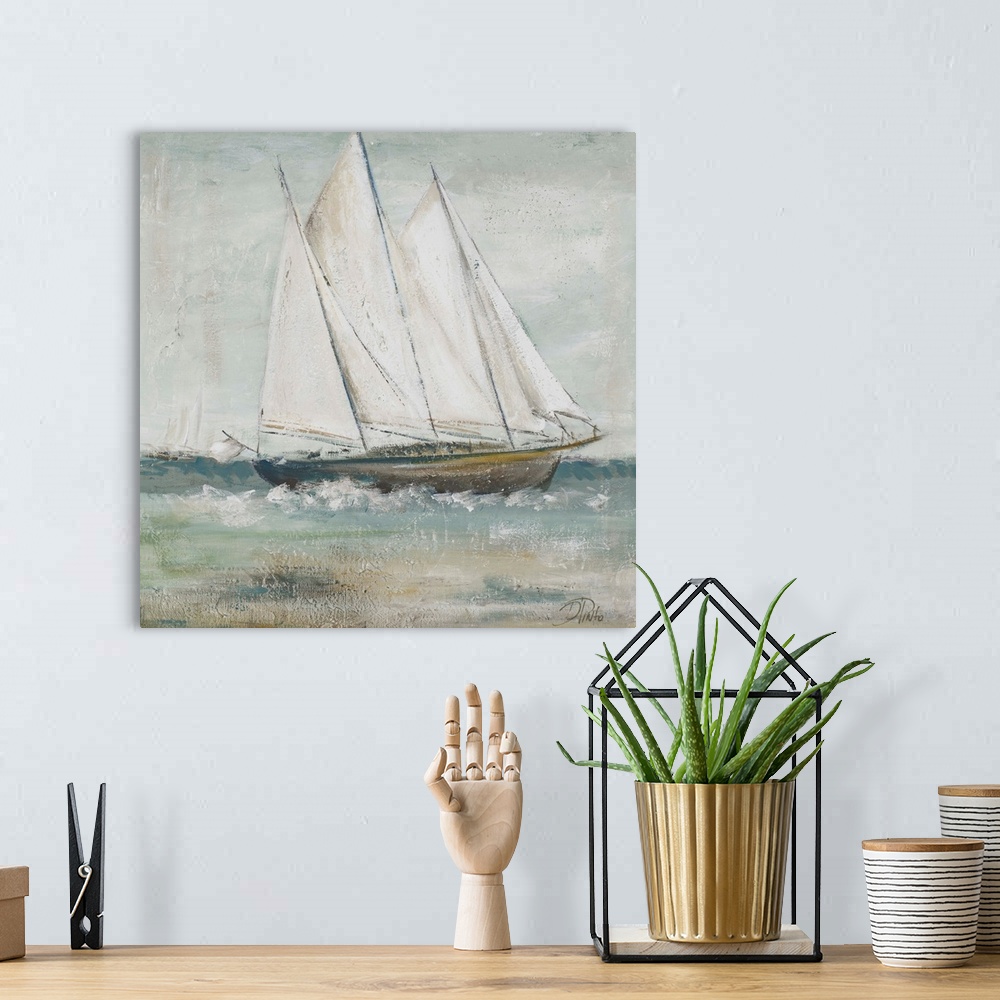 A bohemian room featuring Painting of a sailboat gracefully traversing the seas.