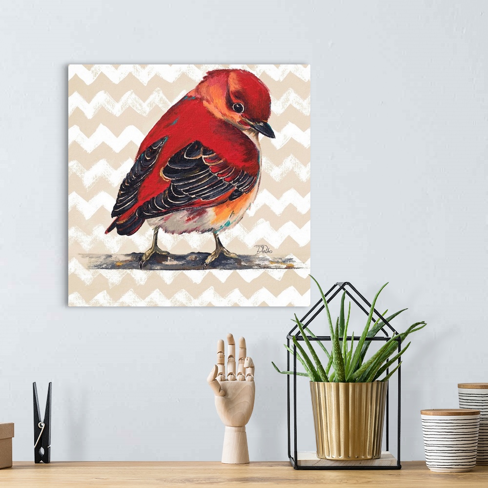A bohemian room featuring Contemporary painting of a red bird against a beige chevron pattern.