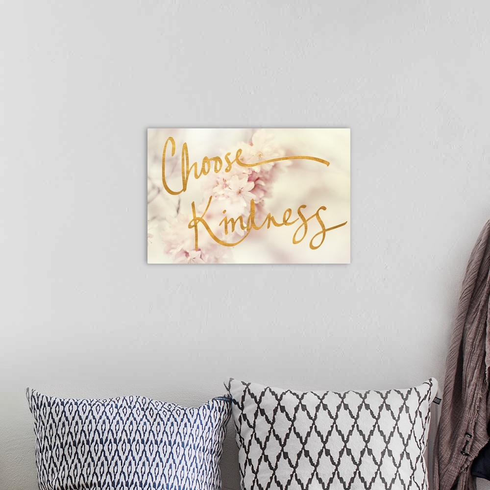 A bohemian room featuring "Choose Kindness" written in gold on top of a dreamy, shallow depth of field photograph of white ...