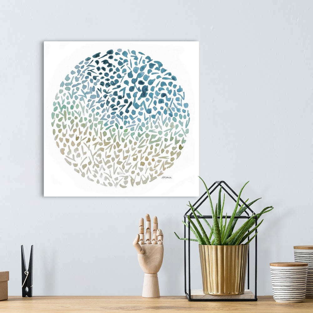 A bohemian room featuring An abstract watercolor painting of flowers making up a circle with blue, green, tan, and gray fad...