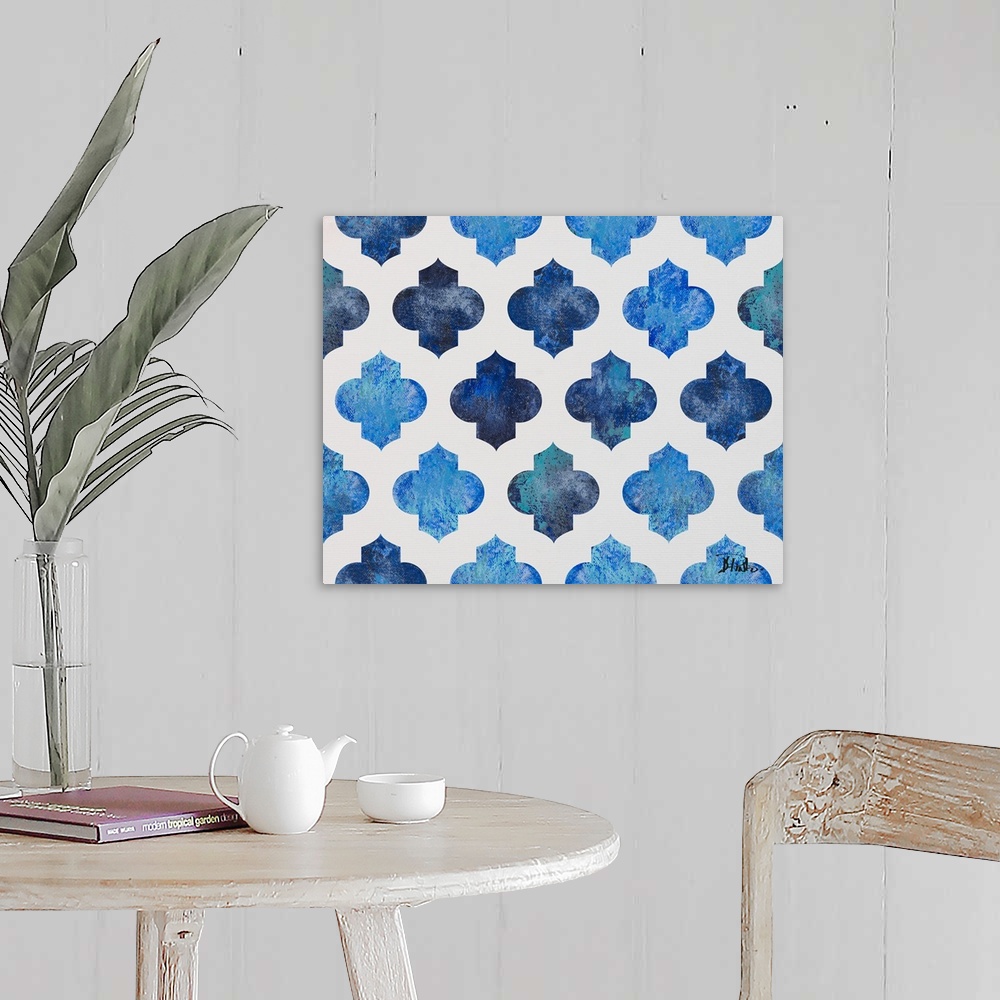 A farmhouse room featuring A symmetric quatrefoil pattern with various shades of blue on a white background.