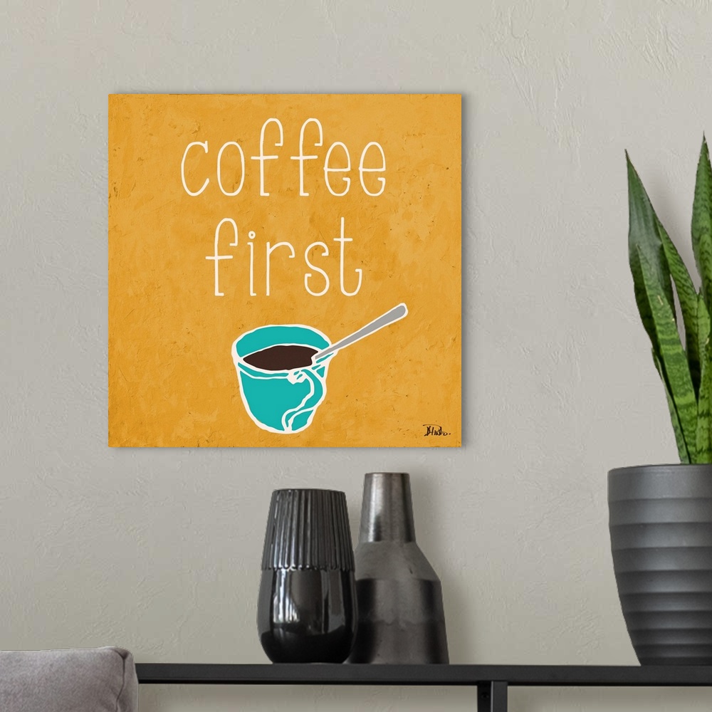 A modern room featuring "Coffee First" on a square yellow background